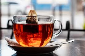 Tea bag being placed into a cup